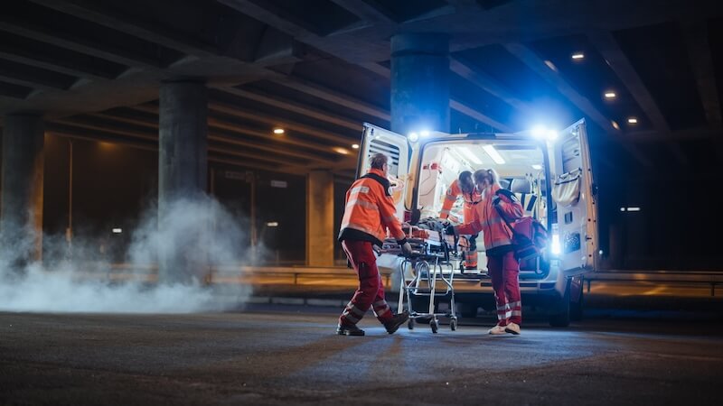 Paramedics working in the back of an ambulance
